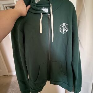 Critical Role Traveler Con Dark Green Zip-Up Hoodie with White Crest Logo